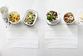 Four different low carb salads with cheese