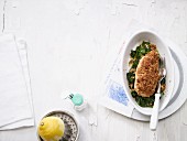Crispy lemon chicken on a bed of spinach (low carb)