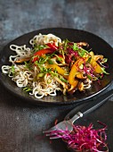 Vegan mie noodles with colourful stir-fried vegetables and shiitake mushrooms