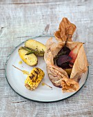 A grilled beetroot parcel with pears and sweetcorn