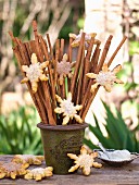 Bunch of sticks decorated with snowflake biscuits