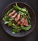 Wild lettuce with peppered steak