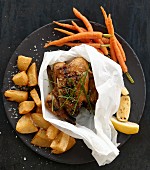 Roast chicken with roast potatoes and carrots
