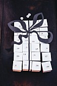 A homemade advent calendar puzzle made from small boxes