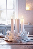 A white Advent wreath made from paper chains