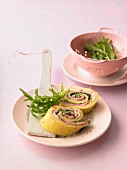 Pancake rolls with ham, sheep's cheese, tomatoes and olives