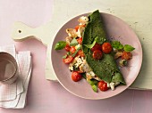 Spinach pancake with mozzarella, tomatoes and turkey breast