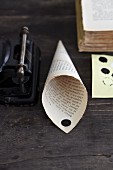 A homemade cone made from a page of a book