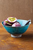 Passion fruits in a blue ceramic bowl