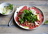 Carpaccio with wild herbs and capers