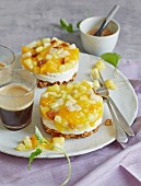 Cheesecake tartlets with yellow fruit compote