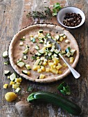 Diced potatoes and courgettes on a wholemeal tart base