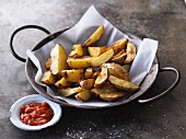 Homemade potato wedges with a Mexican sauce