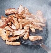 Pork fillet being stir-fried