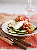 Cod fillet with papaya salsa on zucchini slices