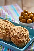Sesame seed rolls and olives