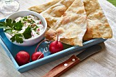 Naan bread with a radish dip