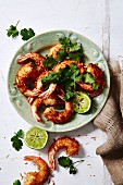 Prawns in a coconut coating with coriander and limes