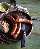 Homemade cheese Kransky sausages with mustard and bread