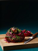 Slow roasted pork knuckle with kale escabeche and red cabbage