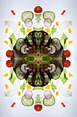 A digital composite of mirrored images of a mixed vegetable salad