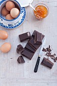 Ingredients for Sachertorte: dark chocolate, eggs and yellow plum jam