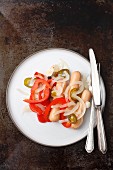 Utopenci (sausages pickled with onions and peppers, Czech Republic)