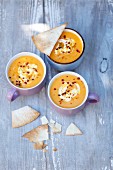 Cream of pumpkin soup with curry and tortilla crisps