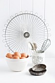 Eggs and various baking utensils