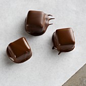 Pralines with dried chocolate drips