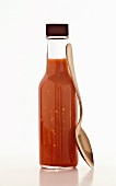 A bottle of spicy chilli sauce