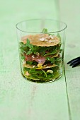 Beef fillet carpaccio with hazelnuts, Parmesan crisps and rocket in a glass