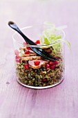 Tea-smoked duck breast with a celery and pomegranate tabbouleh in a glass