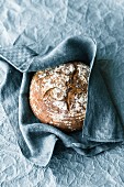 A loaf of crispy sour dough rye bread made with honey