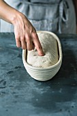 A pressure test for bread dough in a leavening basket