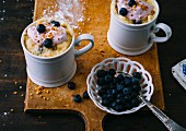 Sour cream mug cake with blueberries and a brittle topping