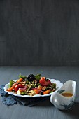 Millet and lentil salad with oven-roasted vegetables and blackberries