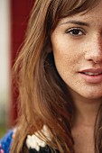 A brunette woman with freckles