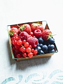 Fresh berries in a wooden basket