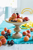 Fruit on a stand made from a wooden base and a pan lid