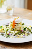 White asparagus tatar with a poached egg