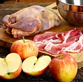 Ingredients for roast pheasant with apple and bacon