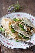 Crêpes with spinach, beans, goat's cheese and herbs