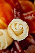 White marzipan roses as cake decoration (close-up)