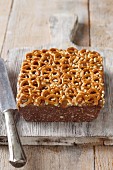 Biscuit cake topped with salted pretzels
