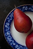 Two red pears on a plate