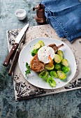 A pork chop with brussels sprouts and a poached egg