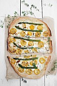 Pizza bianca with ricotta, mozzarella, yellow courgette, asparagus and lemon thyme