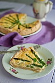 Quiche with asparagus, peas and fresh mint, sliced