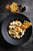 Palm hearts risotto with black truffles, whiskey and Parmesan cheese